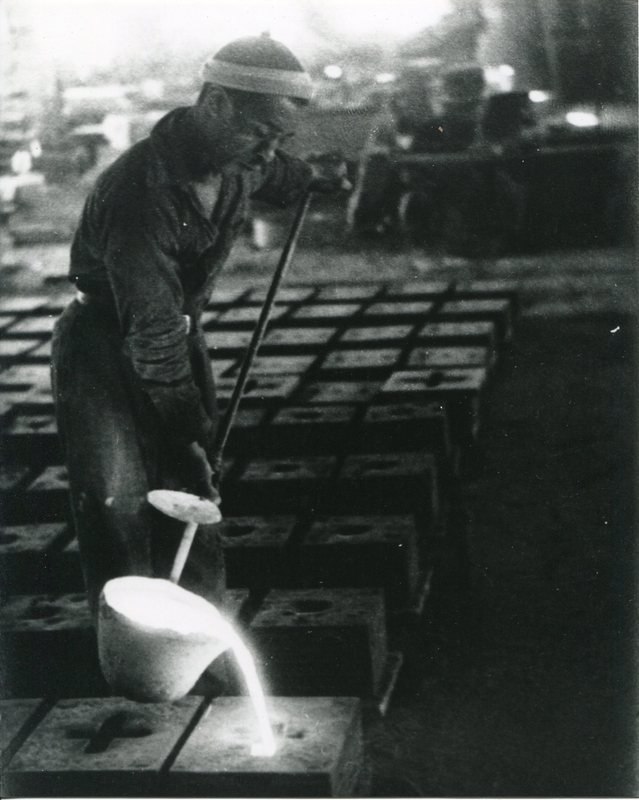 Man casting metal at I.S. Spencer's Sons.jpg