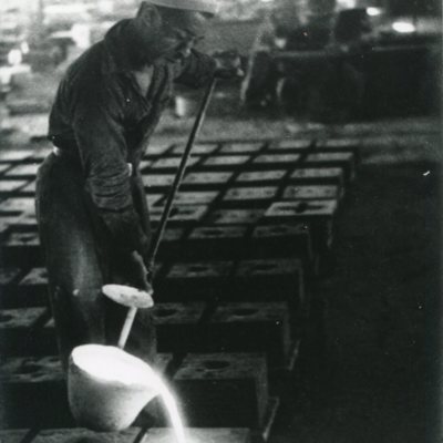 Man casting metal at I.S. Spencer's Sons.jpg