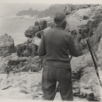 Charles Hubbard painting a scene on the Maine coastline