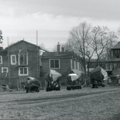 covered boats in front of new building.jpg