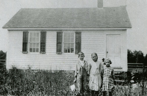 images of the one-room schoolhouse, in 2020 and in 1918.